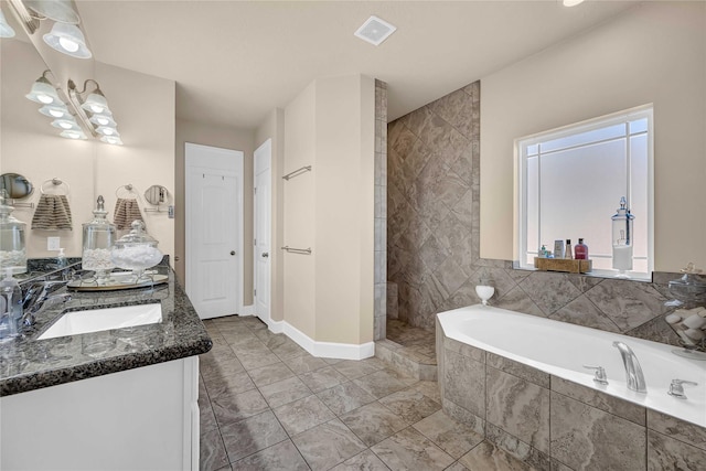 bathroom featuring vanity and shower with separate bathtub