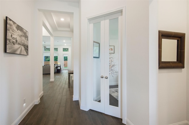 hallway featuring dark wood-type flooring and french doors