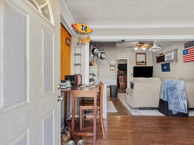 living room with an AC wall unit, hardwood / wood-style floors, and ceiling fan