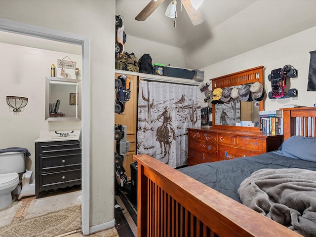 bedroom featuring a ceiling fan and a sink