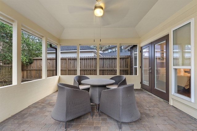 sunroom featuring lofted ceiling