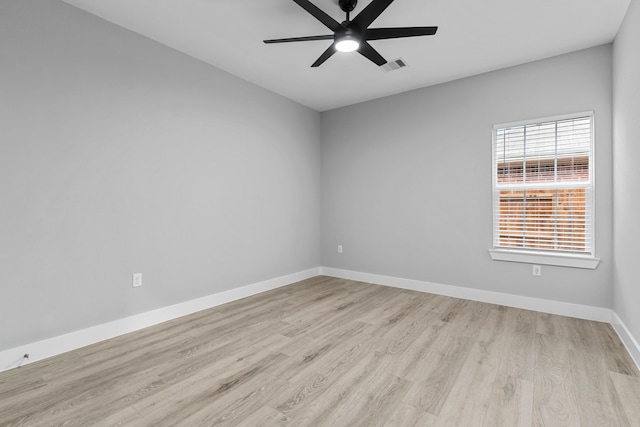 empty room featuring ceiling fan and light hardwood / wood-style floors