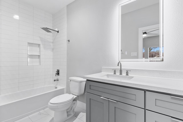 full bathroom with vanity, toilet, and tiled shower / bath combo