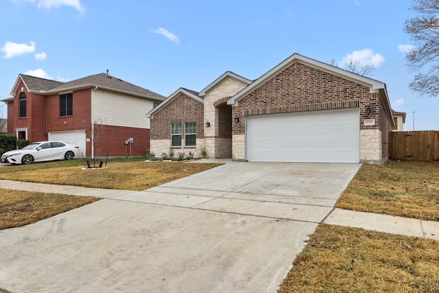 view of front of property featuring a garage and a front lawn