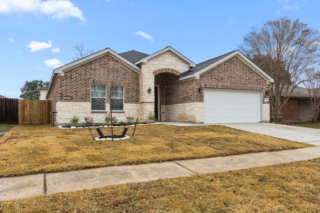 view of front of house with a garage and a front lawn