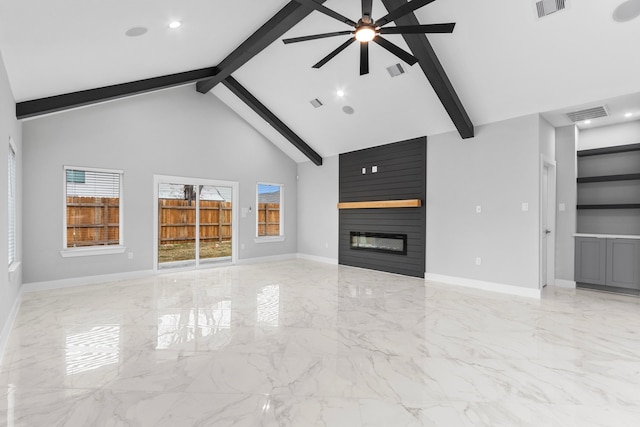 unfurnished living room featuring high vaulted ceiling, beamed ceiling, a large fireplace, ceiling fan, and built in shelves