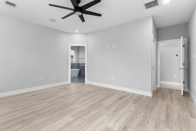 empty room with light hardwood / wood-style floors and ceiling fan