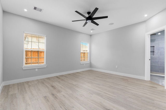 unfurnished room with ceiling fan, a healthy amount of sunlight, and light wood-type flooring