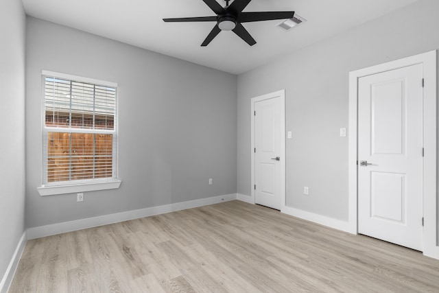 unfurnished room with ceiling fan and light wood-type flooring