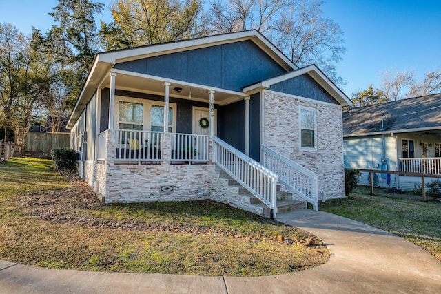 view of front of house featuring a porch and a front yard