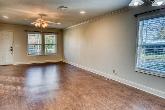 spare room featuring crown molding and ceiling fan