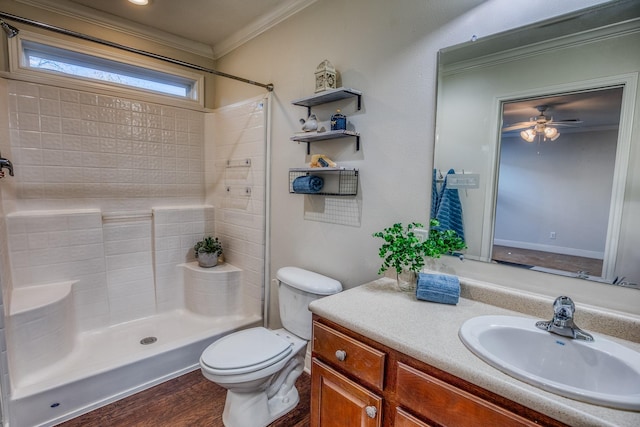 bathroom featuring hardwood / wood-style floors, vanity, ornamental molding, a shower, and toilet