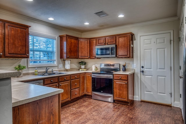 kitchen with ornamental molding, stainless steel appliances, dark hardwood / wood-style flooring, and sink