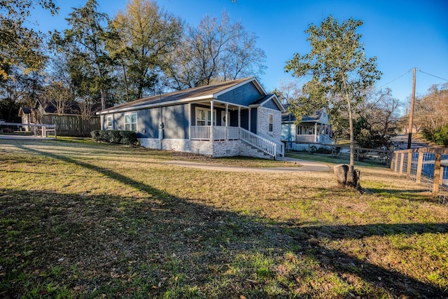 view of front of home featuring a front lawn and a porch