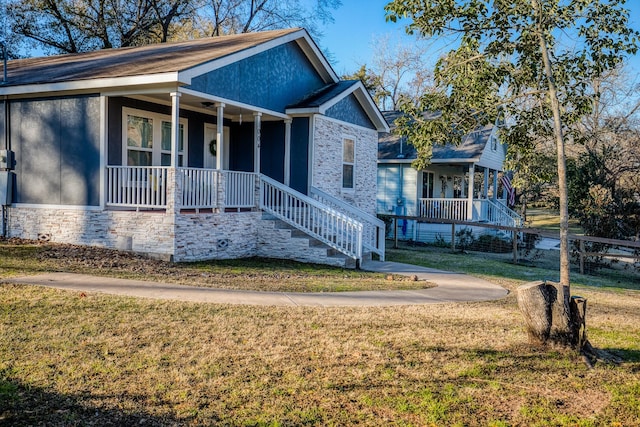 view of front of property with a porch and a front yard