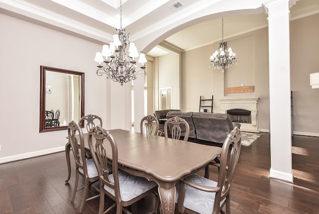 dining room featuring an inviting chandelier, arched walkways, dark wood-style flooring, and a high end fireplace