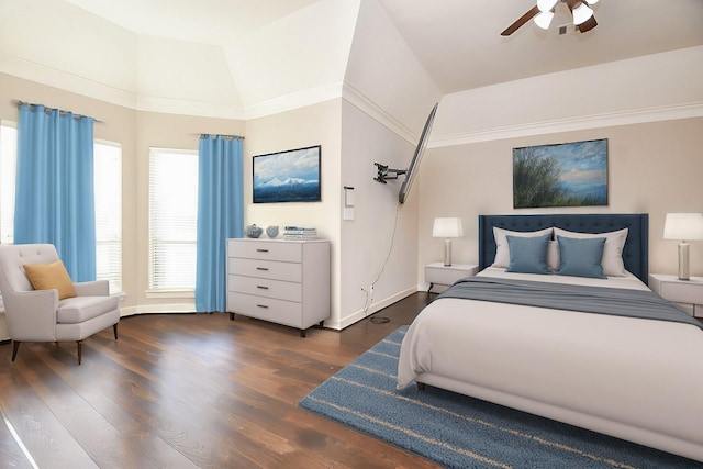 bedroom featuring visible vents, crown molding, baseboards, vaulted ceiling, and wood finished floors