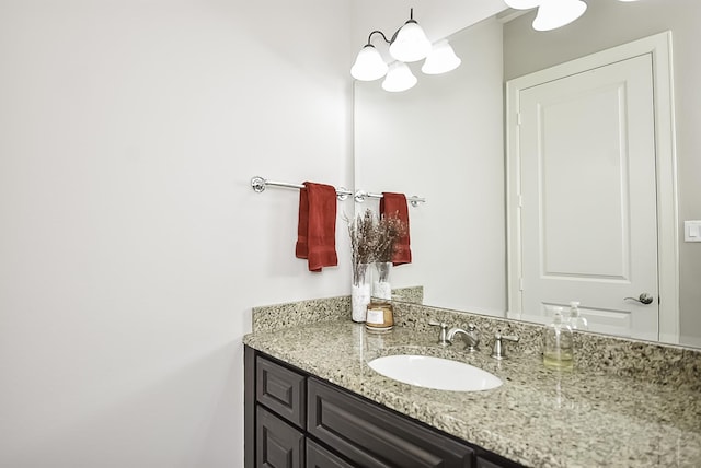 bathroom featuring vanity and an inviting chandelier