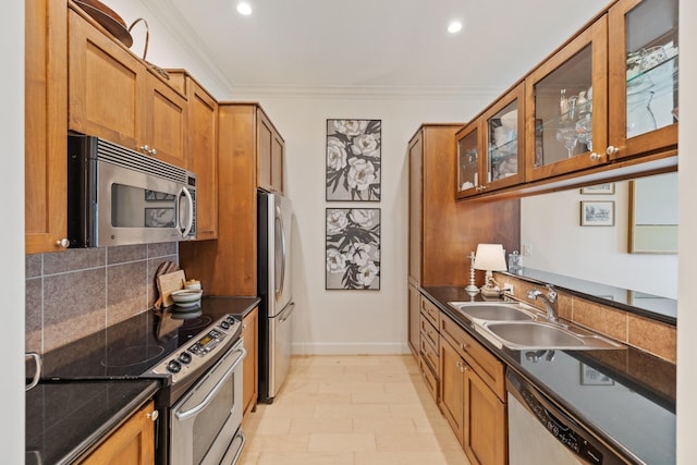 kitchen with sink, decorative backsplash, ornamental molding, and stainless steel appliances