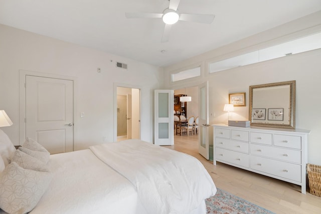 bedroom featuring ceiling fan and light hardwood / wood-style flooring