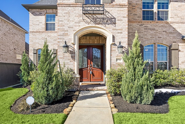 view of exterior entry featuring french doors