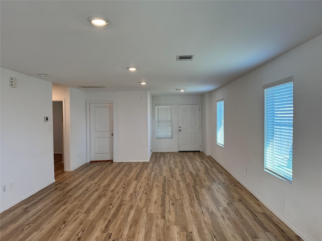 spare room featuring hardwood / wood-style floors