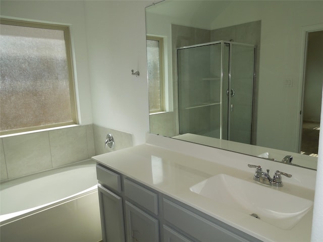 bathroom featuring vanity and separate shower and tub