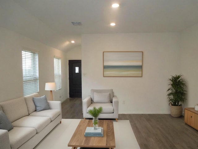 living area featuring recessed lighting, visible vents, vaulted ceiling, wood finished floors, and baseboards