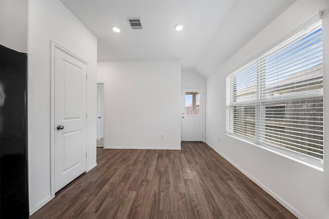 18415 Running Shadow Ct, Hockley, TX 77447 - empty room with lofted ceiling, dark wood-type flooring, baseboards, and recessed lighting