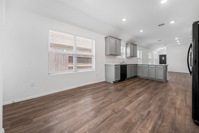 18415 Running Shadow Ct, Hockley, TX 77447 - kitchen featuring gray cabinetry, black appliances, a peninsula, dark wood-type flooring, and recessed lighting
