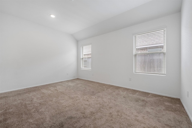 18415 Running Shadow Ct, Hockley, TX 77447 - unfurnished room with carpet flooring, lofted ceiling, and baseboards