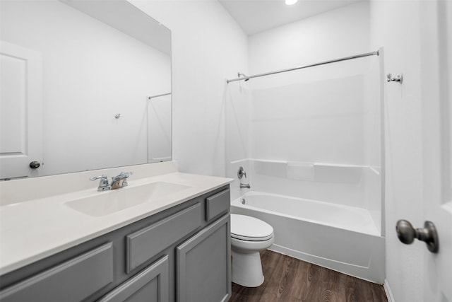 18415 Running Shadow Ct, Hockley, TX 77447 - bathroom featuring toilet, wood finished floors, bathtub / shower combination, and vanity