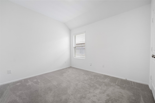 18415 Running Shadow Ct, Hockley, TX 77447 - empty room featuring carpet floors, vaulted ceiling, and baseboards