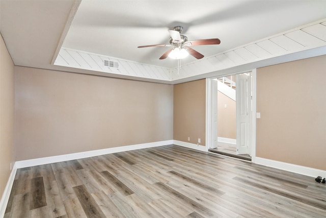 spare room with hardwood / wood-style flooring and ceiling fan