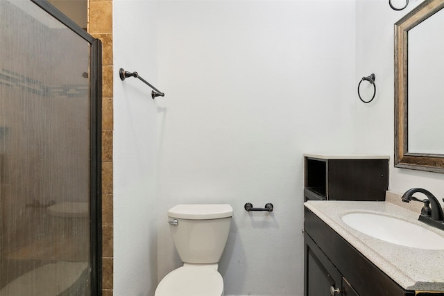 bathroom featuring walk in shower, vanity, and toilet