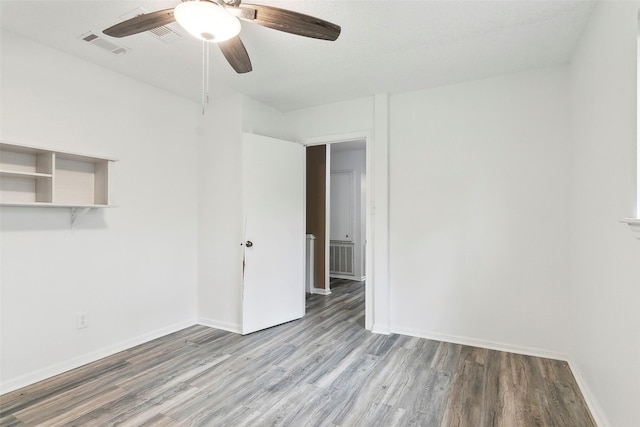 unfurnished room featuring ceiling fan and light hardwood / wood-style floors