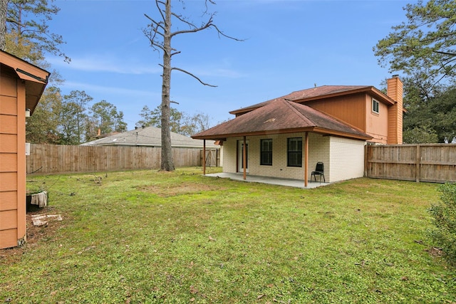 exterior space with a lawn and a patio