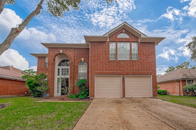 view of front of home featuring a garage and a front lawn