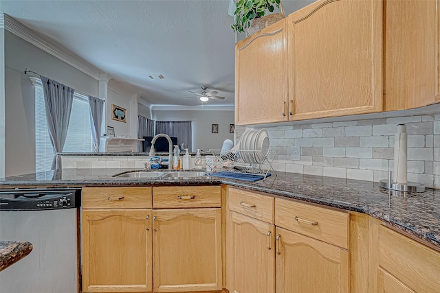 kitchen with light brown cabinetry, sink, dark stone countertops, dishwasher, and backsplash