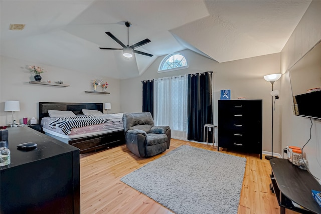 bedroom featuring ceiling fan, lofted ceiling, and wood-type flooring