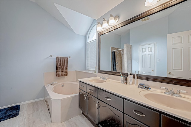 bathroom with shower with separate bathtub, lofted ceiling, and vanity