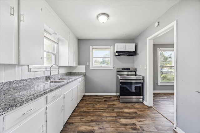 kitchen with dark wood-type flooring, sink, stone countertops, electric stove, and white cabinets