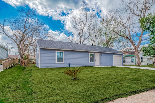 view of front of house with a garage and a front yard