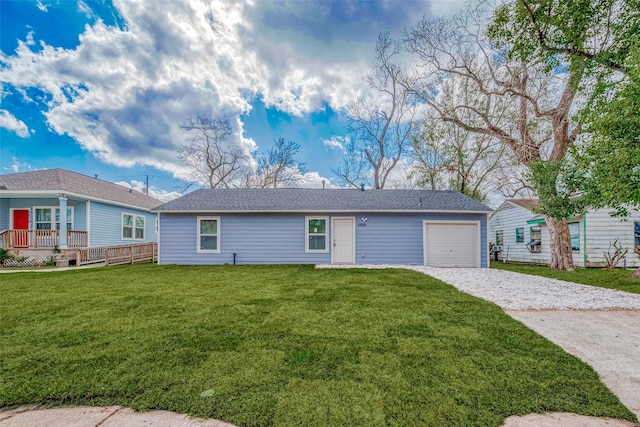 view of front of home with a garage and a front yard