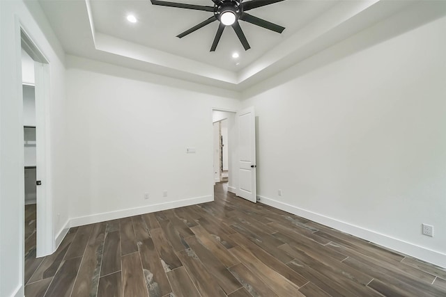 unfurnished room featuring a tray ceiling and ceiling fan