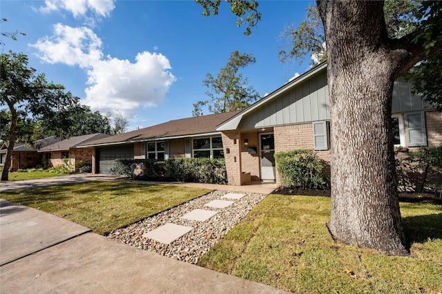 ranch-style home with a garage and a front yard