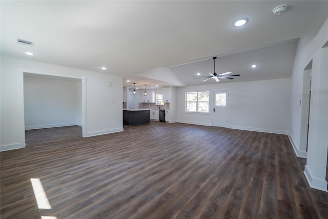 unfurnished living room with ceiling fan, lofted ceiling, and dark hardwood / wood-style floors