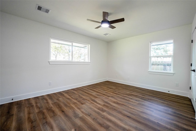 unfurnished room with dark hardwood / wood-style floors and ceiling fan