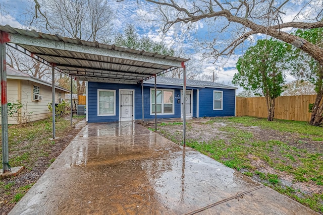 bungalow-style home with a carport