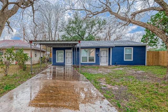 view of front of property with a carport